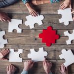 Hipster business successful teamwork concept, business group assembling jigsaw puzzle